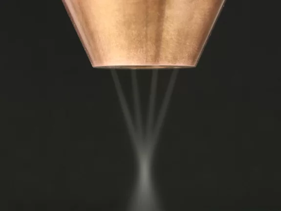 Closeup of the laser stream of an optic with a multi stream nozzle by Laserline diode lasers